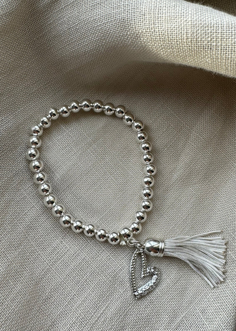Stretch charm bracelet - heart tassel silver-The Style Attic