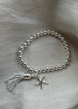Stretch charm bracelet - mini starfish tassel silver-The Style Attic
