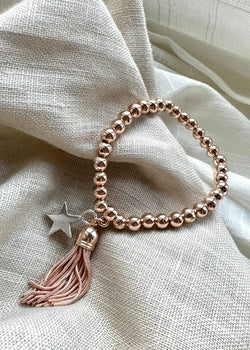 Stretch charm bracelet - star tassel rose-The Style Attic