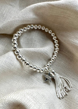 Stretch charm bracelet - star tassel silver-The Style Attic